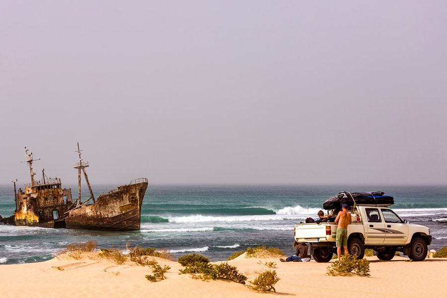 Shipwreck and expedition truck on the beach, Mauritania
